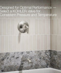 Matte Black Tub And Shower Faucet With Rite Temp Technology, Durable Brass Construction installed in tiled bathroom wall