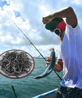 Angler using Bulk Fishing Hooks Set 400 Pcs Assorted Sizes for Freshwater and Saltwater Fishing with Catfish Worm Hooks Gear
