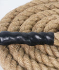 Dope Natural Jute Rope 2 In By 25 Ft 4 Strand Twisted Hemp Rope for crafts, detail of twisted strands with black plastic end.