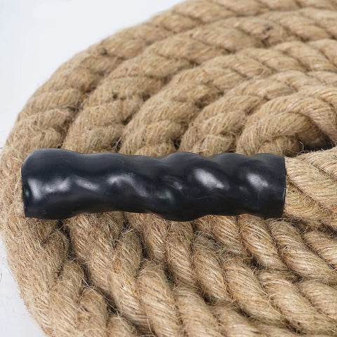 Dope Natural Jute Rope 2 In By 25 Ft 4 Strand Twisted Hemp Rope for crafts, detail of twisted strands with black plastic end.