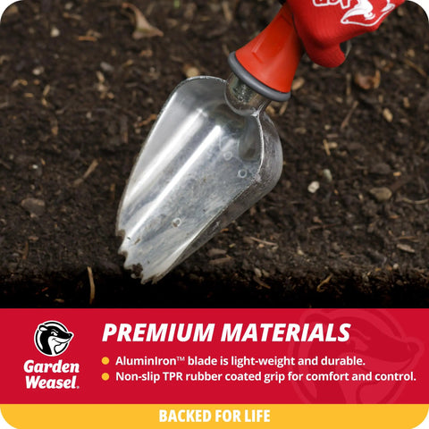 Close-up of oversized potting scoop with serrated tip in soil, showing AluminIron blade and rubber grip for garden tasks.