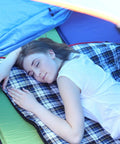 Person sleeping in Cozy 3 Season Sleeping Bag For Camping And Backpacking 75x33 Inches Navy Blue With 2lb Hollow Cotton Fill