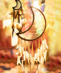 Crescent moon dream catcher with feathers and beads hanging, showcasing 8 Pcs Metal Moon Frame Hoops in Four Sizes.