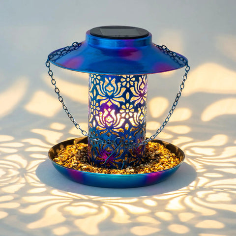 Solar Bird Feeder For Outdoors Hanging Lantern With S Hook Weatherproof Metal Feeder Lights Up At Night And Is Water Resistant Cardinals Garden Decor In Blue A Thoughtful Gift For Women Mom Grandma Bird Lovers. Showcasing intricate design and blue hue in use.