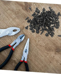 100 Piece Mini Machine Screws For Furniture Repair And DIY Projects Rock Solid Tiny Fasteners with pliers on wooden surface.