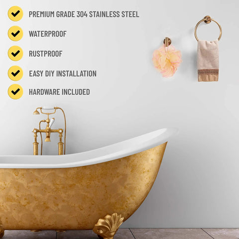 Gold Brushed 7 Piece Bathroom Accessory Kit Wall Mounted Featuring towel ring holding a towel above gold bathtub in modern bath