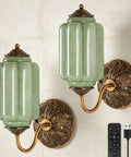 Culwunp Battery Operated Wall Sconce Set of 2 with green glass shades and ornate gold metal mounts, ideal for stylish lighting.