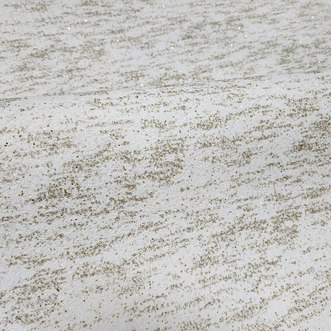 Top Shelf Vinyl Textured Wallpaper In Crisp Off White Cream Accented With Shimmery Gold Mica Chips Washable Removable And Humidity Friendly Wall Roll For Low Key Room Refreshes close-up showing cream base with gold mica texture.