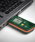 USB Humidity And Temperature Datalogger With SD Card Storage And Excel Export connected to laptop for data transfer.