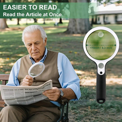 Rechargeable Illuminated Handheld Magnifier With 48 LED Lights, 10X 20X 45X Zoom, Scratch Resistant 4.3 Inch Lens in use by a senior reading a newspaper outdoors.