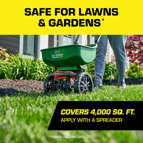 Person using a spreader to apply Castor Oil Based Mole And Gopher Repellent Granules For Lawn And Garden with Ground Penetrating Technology