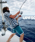 Man fishing on a boat wearing Go To Balaclava Ski Mask Neck Gaiter For Men And Women Open Or Closed Face Shield With UV Protection