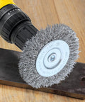 Drill with stainless steel wire wheel on metal, part of Four Piece Three Inch Stainless Steel Wire Wheel Brush Kit For Drills With One Quarter Inch Shank Ideal For Power Grinders Rust Removal Paint Scale Removal Deburring Edge Blending And Surface Prep.