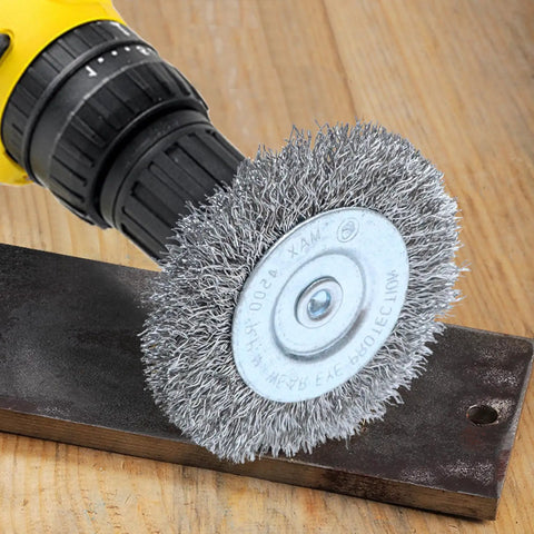 Drill with stainless steel wire wheel on metal, part of Four Piece Three Inch Stainless Steel Wire Wheel Brush Kit For Drills With One Quarter Inch Shank Ideal For Power Grinders Rust Removal Paint Scale Removal Deburring Edge Blending And Surface Prep.