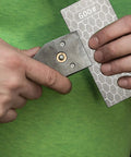 Person holding a 600 grit diamond plate honing stone for kitchen sharpening, part of the Four Pieces Diamond Sharpening Stone Grit Diamond Plate Honing Stone For Kitchen Sharpening Dull Edges Get Your Edge Back 5.9 By 2.48 Inches With 400 600 1000 And 1200 Grits set.