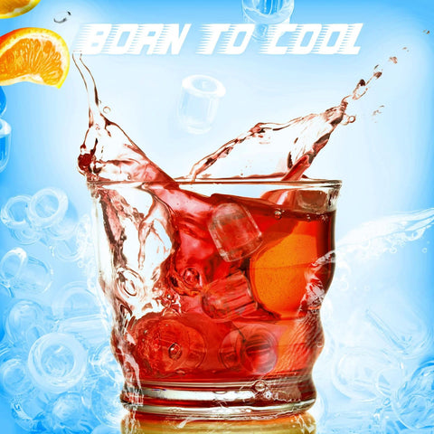 Glass tumbler with red beverage and ice cubes splashing; orange slice on blue background
