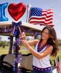Woman decorating a golf cart with Patriotic Golf Cart Decorations Kit For 4th Of July And 250th Anniversary, USA foil balloons