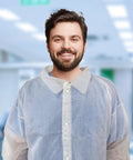 Man wearing White Disposable Lab Coats For Adults X Large Pack Of 10 Unisex Lab Gowns For Students in laboratory