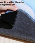 Person peeling back 16 Pack Rug Gripper Pads For Hardwood Floors And Tile Non Slip Double Sided Tape showing easy removal and no residue