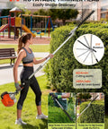 Woman using Beast 5-In-1 Gas Powered Yard Tool With 52cc 2-Stroke Engine rotating trimmer head on hedges in a park