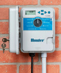 XC600 X-Core Six Zone Outdoor Sprinkler Controller With Easy Install Timer on brick wall