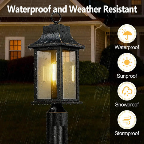Dusk to Dawn Outdoor Post Light 19.29 Inch Matte Black Lamp Post With Pier Mount, shown lit in rainy weather, close-up view