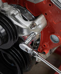 Eleven Piece Deep Socket Set For Three Eighths Inch Drive, Twelve Point SAE Sockets With Chamfered Opening In Use On Engine