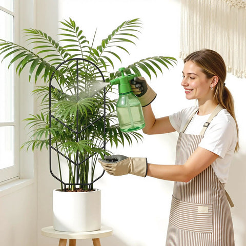 Woman watering plant using Heavy Duty 2 Pack 30 Inch Metal Plant Trellis For Climbing Plants, tall indoor outdoor support.