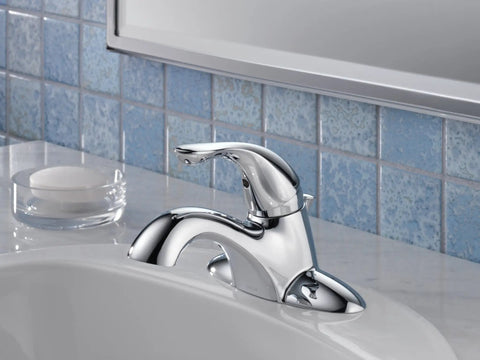 Chrome Centerset Bathroom Faucet For 4-Inch 3-Hole Vanity Sink With Metal Push-Pop Drain Assembly installed on modern vanity sink