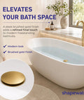 Heavy Duty Brass Pop Up Drain For Freestanding Tub With Brushed Gold Finish And Smart Hair Catcher To Beat Clog Headaches and Keep Your Jewel Drops Secured Tight in modern bathroom setup.