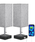 Set Of 2 USB Nightstand Lamps With Grey Fabric Shade Small Table Lamps For Bedroom End Table Living Room Or Home Office Built In 5 Volt 2 Amp USB Ports To Charge Two Devices While You Sleep, showing two lamps with USB ports charging a phone and smartwatch.