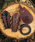 Dope 3 Piece Renaissance Accessories Set Featuring Legit Vintage Viking Belt And Premium Crafted Leather Bracers For Badass Medieval Cosplay Festival Flex on wood.