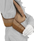 Adjustable Rifle And Shotgun Shoulder Shield With Leather Recoil Pad For Hunting And Archery shown on a right shoulder