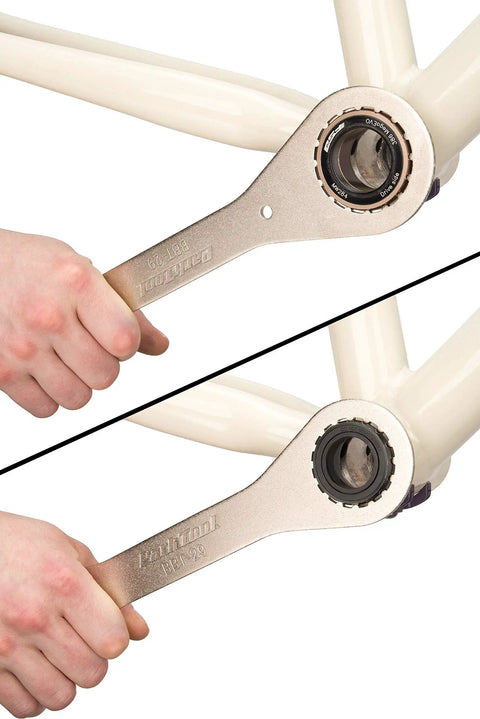 BBT-29 Double-Ended Bottom Bracket Tool For 16-Notch Cups 39mm And 48.5mm in use on a bike's bottom bracket