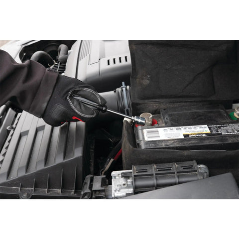 Person using 85 Piece SAE And Metric Socket Set With One Quarter Inch, Three Eighths Inch And One Half Inch Drives on car battery