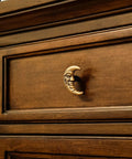 Set Of Six Gold Finish Cast Iron Crescent Moon Face Drawer Pulls For Celestial Decor installed on wooden drawer