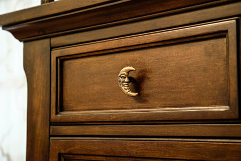 Set Of Six Gold Finish Cast Iron Crescent Moon Face Drawer Pulls For Celestial Decor installed on wooden drawer