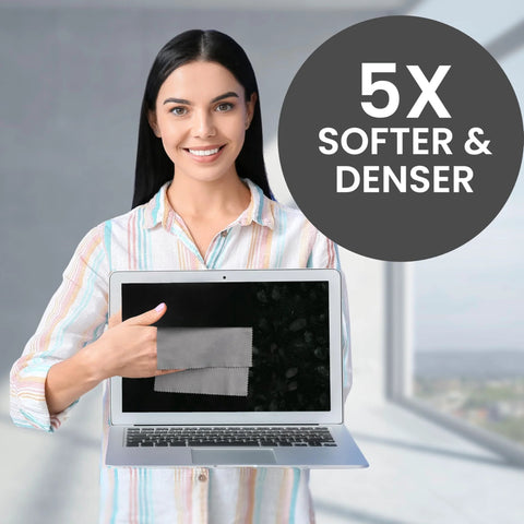 Microfiber screen-cleaning cloth on a laptop screen held by a smiling woman; circular badge reads 5X SOFTER & DENSER.