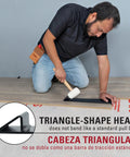 Man using Maverick Wide Angle Pull Bar for Vinyl Laminate and Wood Flooring Installations Triangular Head Absorbs 10x Strike Force