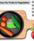 Top-down view of KLEENE 2-piece stainless steel crinkle cutter set on a wooden cutting board with carrot and tomatoes