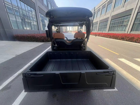 Yellow Electric Golf Cart Two Seater With Cargo Bed showing rear view and spacious cargo area on a sunny day.