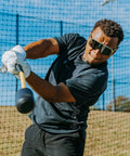 Man using Patented Swing Trainer With 12 Soft Training Balls For Baseball And Softball Build Speed Stay Connected Train Full Body Mechanics And Get Instant Swing Feedback With This Durable Batting Aid outdoors