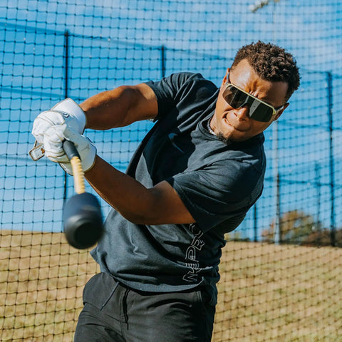 Man using Patented Swing Trainer With 12 Soft Training Balls For Baseball And Softball Build Speed Stay Connected Train Full Body Mechanics And Get Instant Swing Feedback With This Durable Batting Aid outdoors