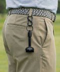 Mini-Mag Magnetic Club Brush for Golf clipped to golfer's belt, compact quick release handle visible.