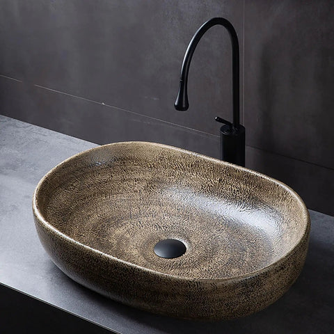 Oval Ceramic Vessel Sink for Bathroom, Retro Modern Above Counter Vanity Sink for Home or Hotel, Stylish Wash Bowl (Multi-colored-Small) with textured brown finish.