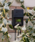 Outdoor Low Voltage Transformer 60W with Timer and Built In Photo Sensor for 12V Landscape Lighting mounted on a wall