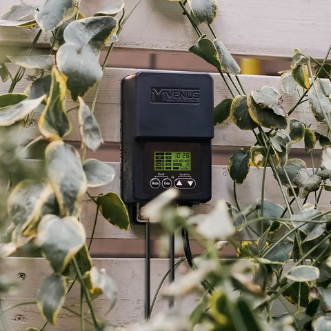 Outdoor Low Voltage Transformer 60W with Timer and Built In Photo Sensor for 12V Landscape Lighting mounted on a wall