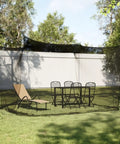 10x10x8.2 Ft Outdoor Mosquito Netting For Camping Patio And Travel With Hanging Ropes over grass with chairs and lounge chair