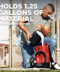 Man pouring paint into Tough As Nails 18V Cordless Airless Paint Sprayer With Advanced HEA Tech in backyard setting.