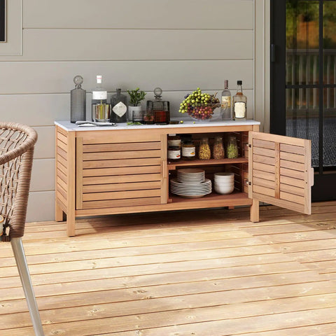 Outdoor Patio Storage Cabinet With Faux Marble Top Two Door Acacia Wood Console Sideboard For Deck Garden Backyard And Entryway Rustic Modern Farmhouse Vibe And All Weather Durability on wooden deck, partially open with items inside.